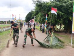 Sambut Hari Kemerdekaan RI, Satgas Yonif 123 Rajawali dan Warga Gotong Royong Bersihkan Jalan Kampung